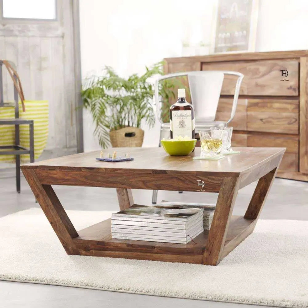 A Solid sheesham wood double top coffee table with geometric cut-outs in the legs.