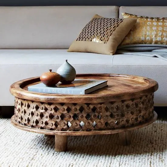 Solid mango wood hand-carved, round shaped isha coffee table with intricate patterns.