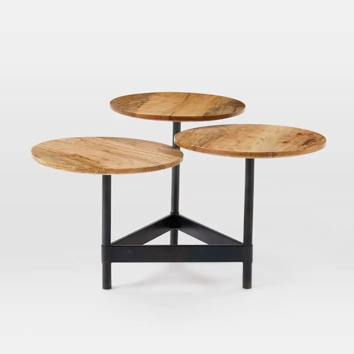 Three-tiered mango wood table with black metal legs.