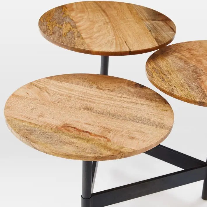 Three wooden round tables tops with a black metal base.