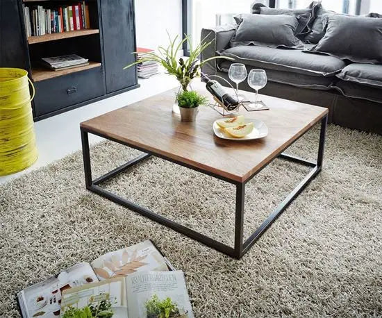 A square coffee table with a natural sheesham wood top and black metal frame base.