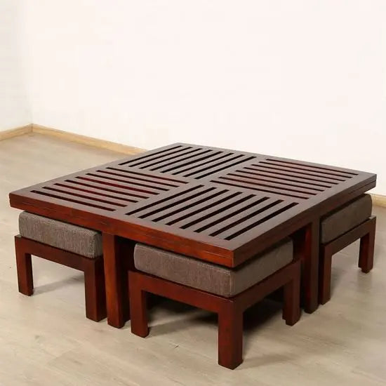Solid wood square slatted design top Jolly coffee table accompanied by four upholstered stools.