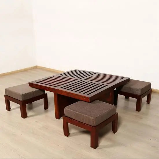 Solid sheesham wood square slatted design top Jolly coffee table accompanied by four upholstered stools.