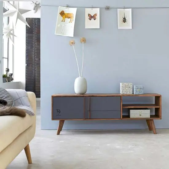 A modern straight-line design Pantone TV cabinet with two doors and two open shelves, made of solid Sheesham wood with MDF doors.