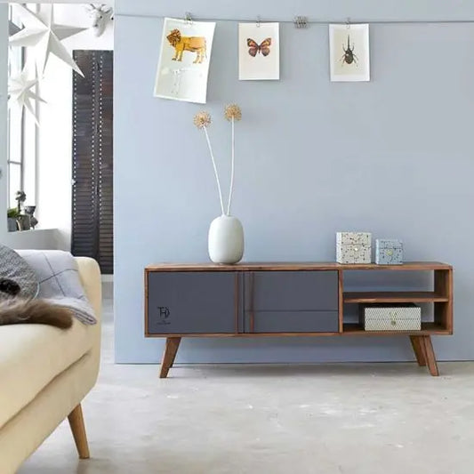 A modern straight-line design Pantone TV cabinet with two doors and two open shelves, made of solid Sheesham wood with MDF doors.