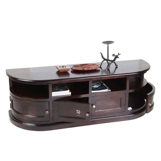 A brown, half-round shaped TV cabinet with four doors and a shelf, made of wood, with metal handles and a decorative item on top.
