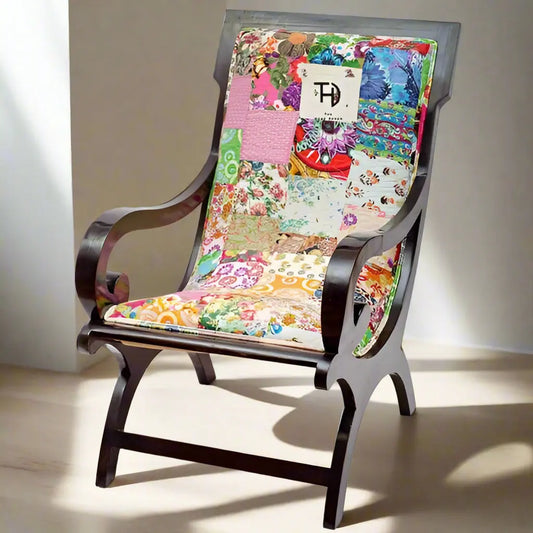 Relax Chair with a walnut stained sheesham wood structure and multicolored patchwork fabric upholstery.