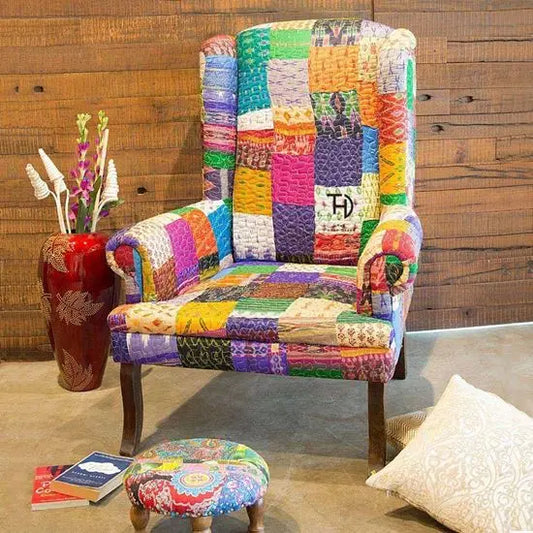 A silk patch wing chair with multicolored patchwork fabric on a wooden frame.