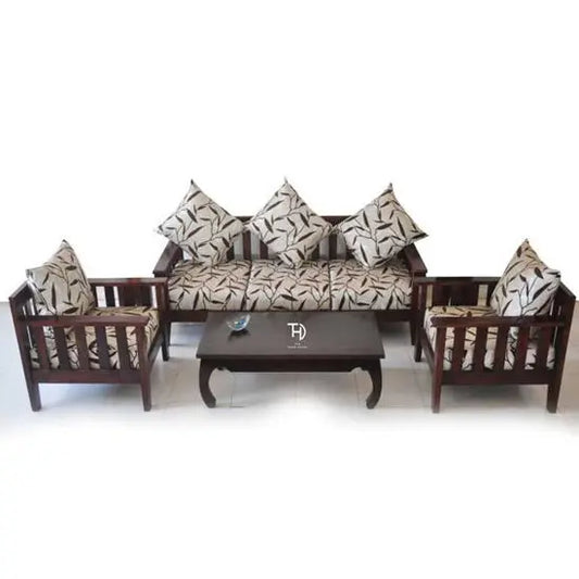 A three-seater sofa and two single-seater chairs made of Sheesham wood, upholstered with a patterned fabric, along with a wooden coffee table. Cushions are included, enhancing the aesthetic appeal of the set.