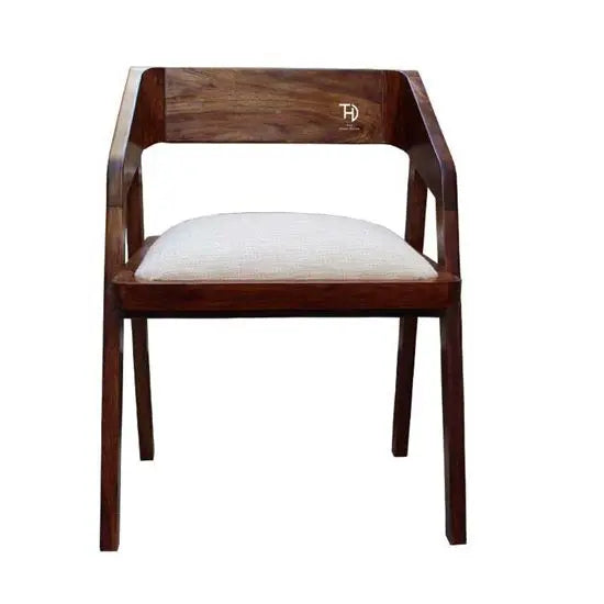 A brown Loria chair with an upholstered seat, made from solid Sheesham wood.