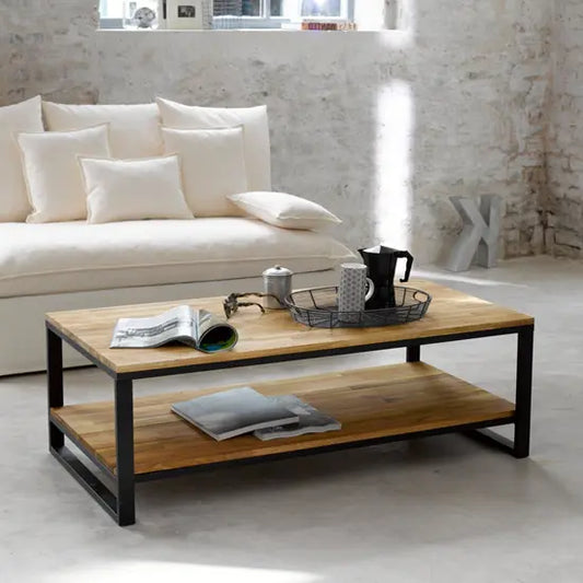 A modern industrial coffee table with a mango wood top and metal base.