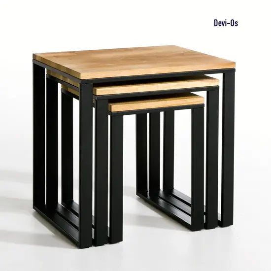 A set of three Devi metal stools with black legs and a mango wood top, arranged in a nested configuration.
