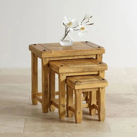 Top group devi stool set of 3 pcs made in solid mango wood, stacked together, with visible wood grain and natural finish.