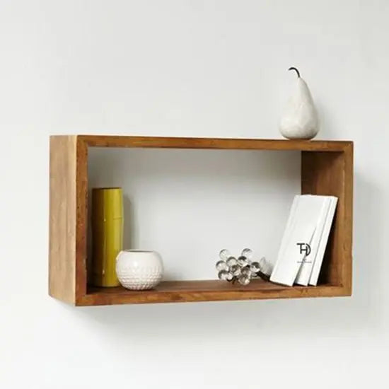 A rectangular wooden wall rack mounted on a white wall, with various decorative items placed on its shelves. Its simple, strong but effective