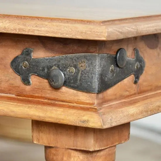 Solid Wood rectangular vintage coffee table with decorative iron corners.