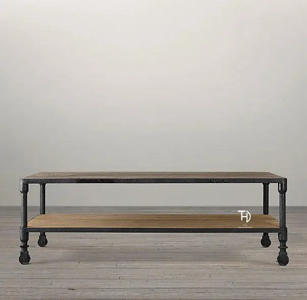 A rolling wheel coffee table with a black metal frame and wooden tabletop, accompanied by a lower shelf made of wood.