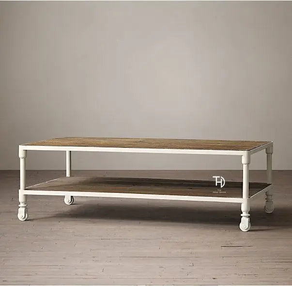 A white coffee table with a wooden tabletop, featuring a simplistic design with metal frame and wheels.