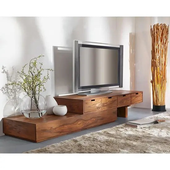 A wooden Zozo TV Cabinet with three drawers, featuring a zigzag design. The TV cabinet has a brown finish and is placed in a room with a modern decor.