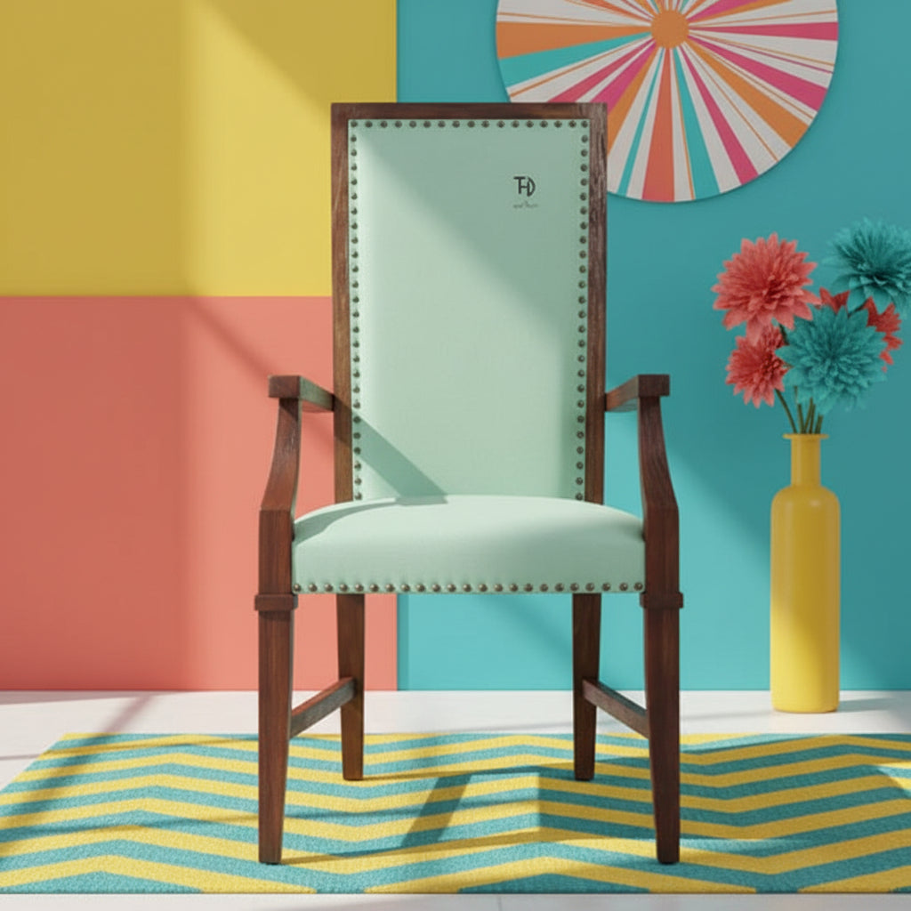 A wooden chair with armrests upholstered in green fabric, featuring a walnut finish.