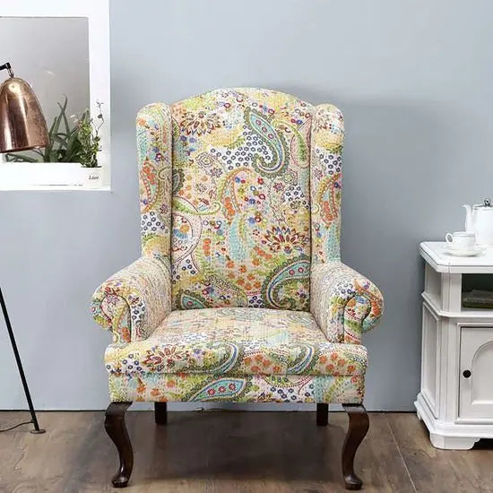 A Katha Maharaja sofa with a floral fabric design with high back.