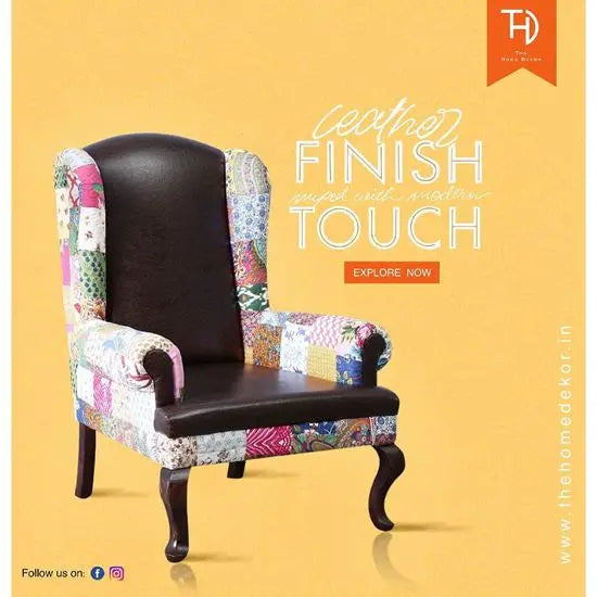 A luxurious Maharaja Wing Chair with a leather finish, featuring a combination of fabrics on the sides and back, with Sheesham wood structure.