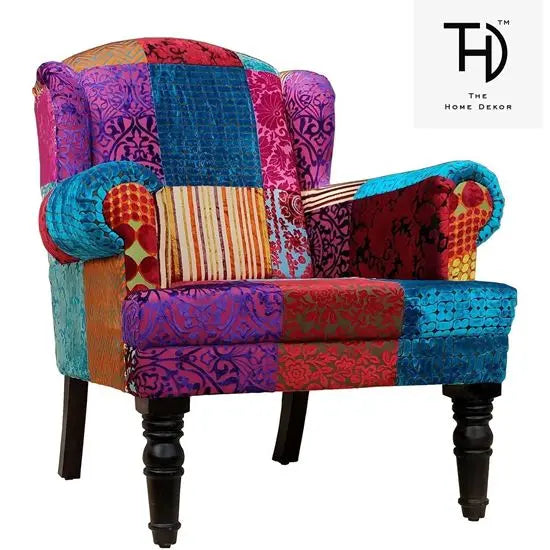 Maharaja wing chair with wooden legs, featuring a solid pattern with various textures and colors.