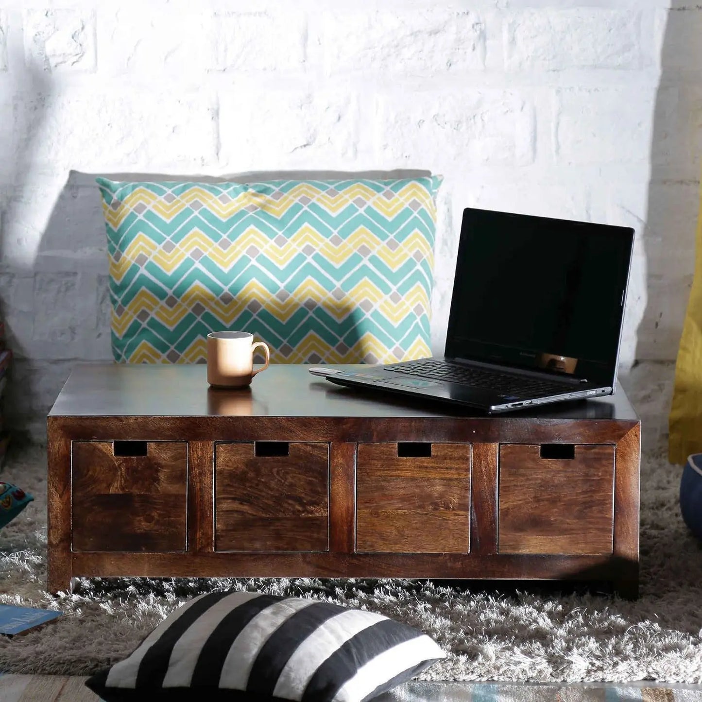 A rectangular Eight drawer low height octeeno coffee table made in solid sheesham wood.