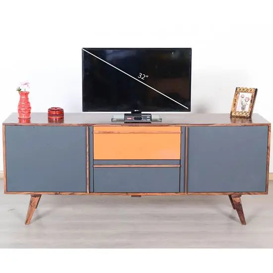 A modern sideboard with gray and orange colors, featuring a flat-screen TV on top. Made from Sheesham wood and MDF.