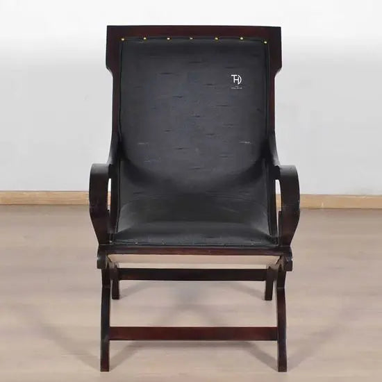 A black artificial leather upholstered Rambo Relax chair with walnut finish.
