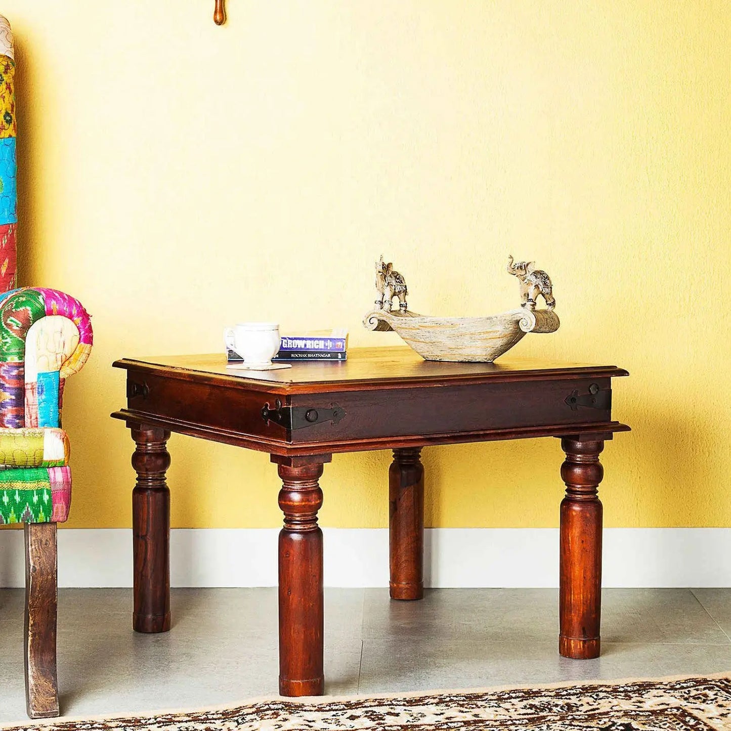 A rectangular brown solid sheesham wood Sangy coffee table with four legs.