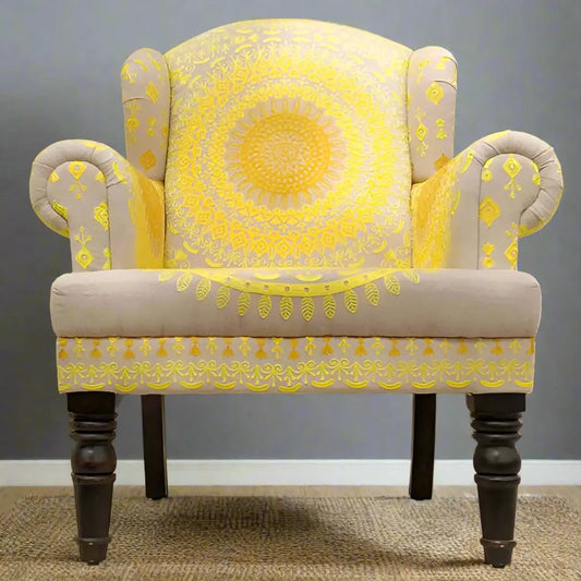 A yellow embroidered upholstered Maharaja sofa with intricate embroidery fabric, featuring a wooden structure and wing chair design.