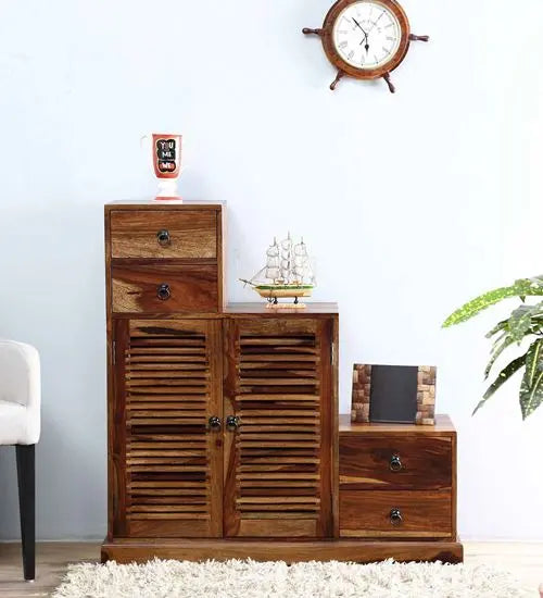 A wooden cabinet with a walnut finish featuring multiple storage spaces, including drawers and doors.