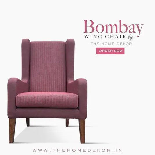 A pink Bombay wing chair with a high backrest and armrests.