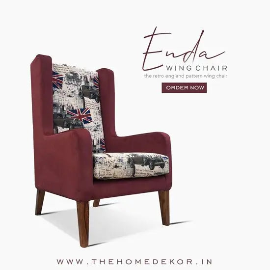 A red upholstered wing chair with a sheesham wood frame, featuring a floral and geometric pattern on the fabric.