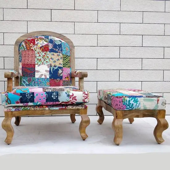 An assorted patchwork chair with a stool, featuring a patchwork fabric upholstery with multicolored patch designs.
