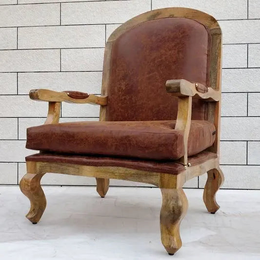 A brown upholstered cushioned chair with curved wooden legs and a tufted backrest.