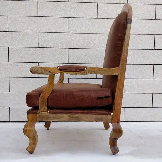 A brown upholstered cushioned chair with curved wooden legs online at best prices.
