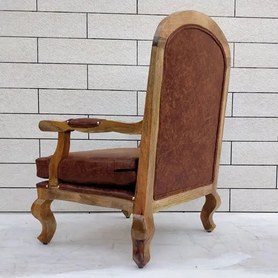A brown upholstered cushioned chair with armrest.