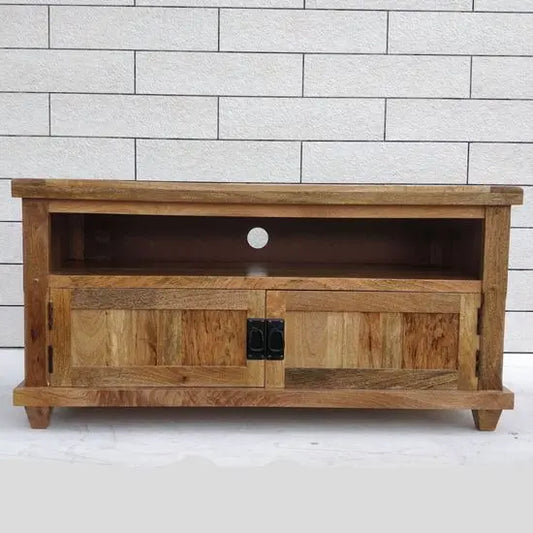 A wooden Devi TV cabinet with an open shelf and a closed compartment with a door, presented in an online product setting against a neutral background.