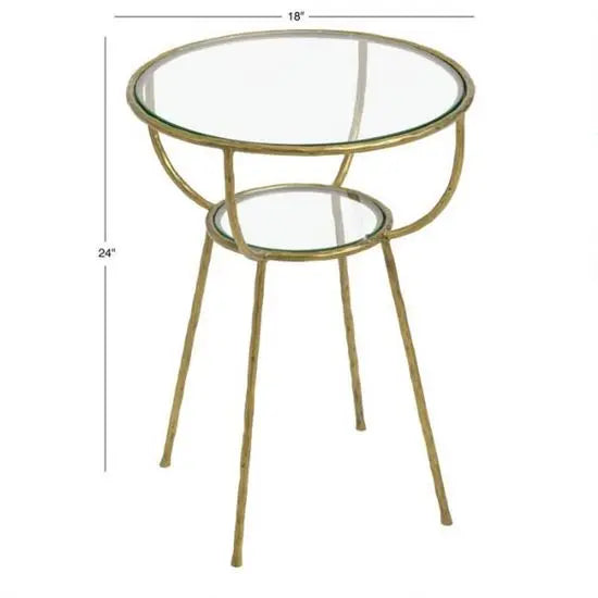 A Hammering Side Table with a hammered finish golden color metal base and a clear glass top.