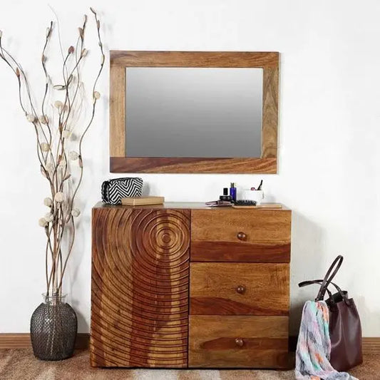 A wooden spiral cabinet with a mirror on top and multiple drawers.
