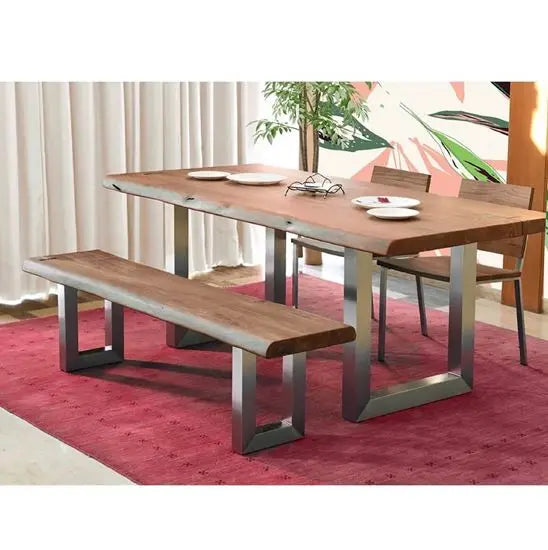 A rustic charm dining set with a live-edge table and bench made of acacia wood with silver metal legs, accompanied by two chairs with metal legs.