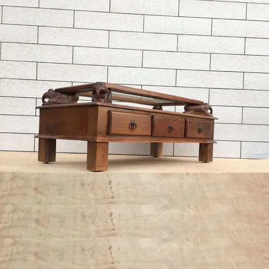 Solid mango wood rectangular brown Three drawer and carved elephant details on the sides Asgil coffee table.