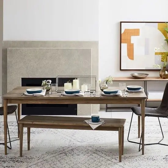 Dining table with bench in light color.