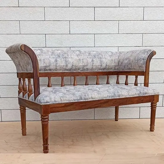 A fabric-upholstered Alvin sofa with Sheesham wood frame and round legs.