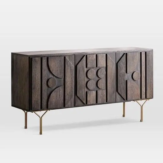 A sideboard with gold-colored legs and geometric patterns on the front, featuring a combination of wood and metal materials.