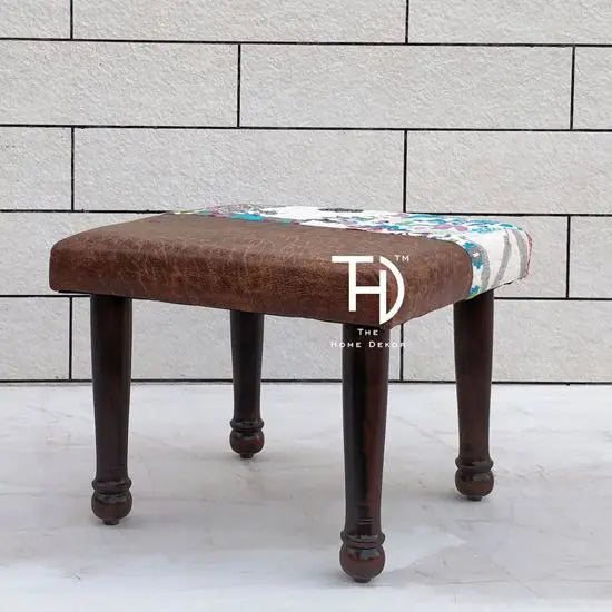 A brown and multicolor patchwork fabric-covered chowk.