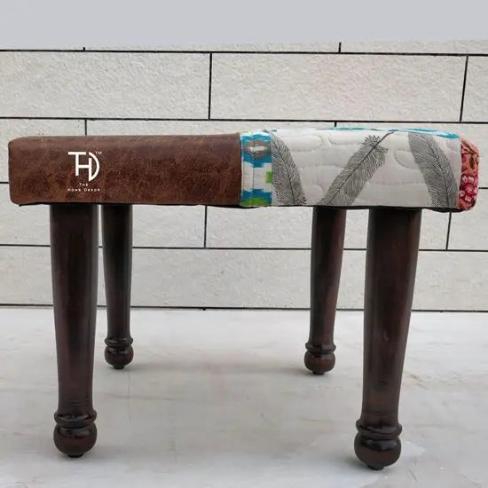A brown and multicolor patchwork stool.