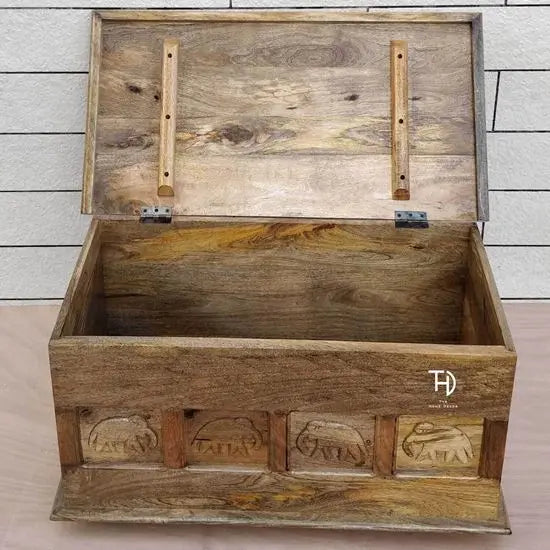 Solid Mango wood rectangular one upper door storage Carob trunk mango coffee table with elephant carvings on the front.
