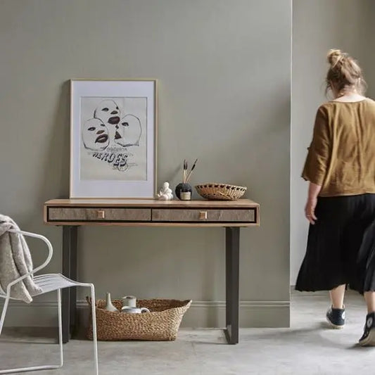 A Jarrah Console Table with acacia wood top and metal legs, featuring two drawers.